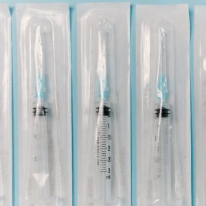 Close-up of sterile syringes in packaging, ideal for medical and healthcare use.