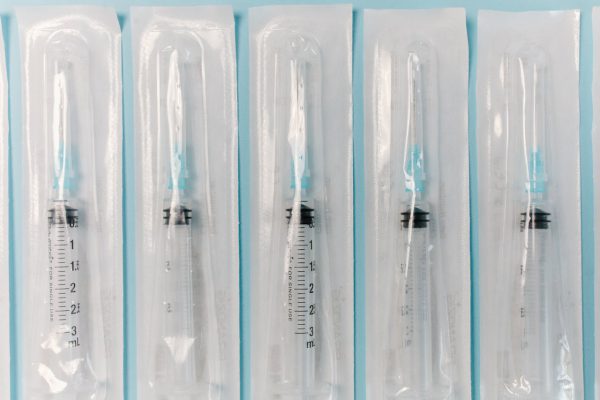 Close-up of sterile syringes in packaging, ideal for medical and healthcare use.